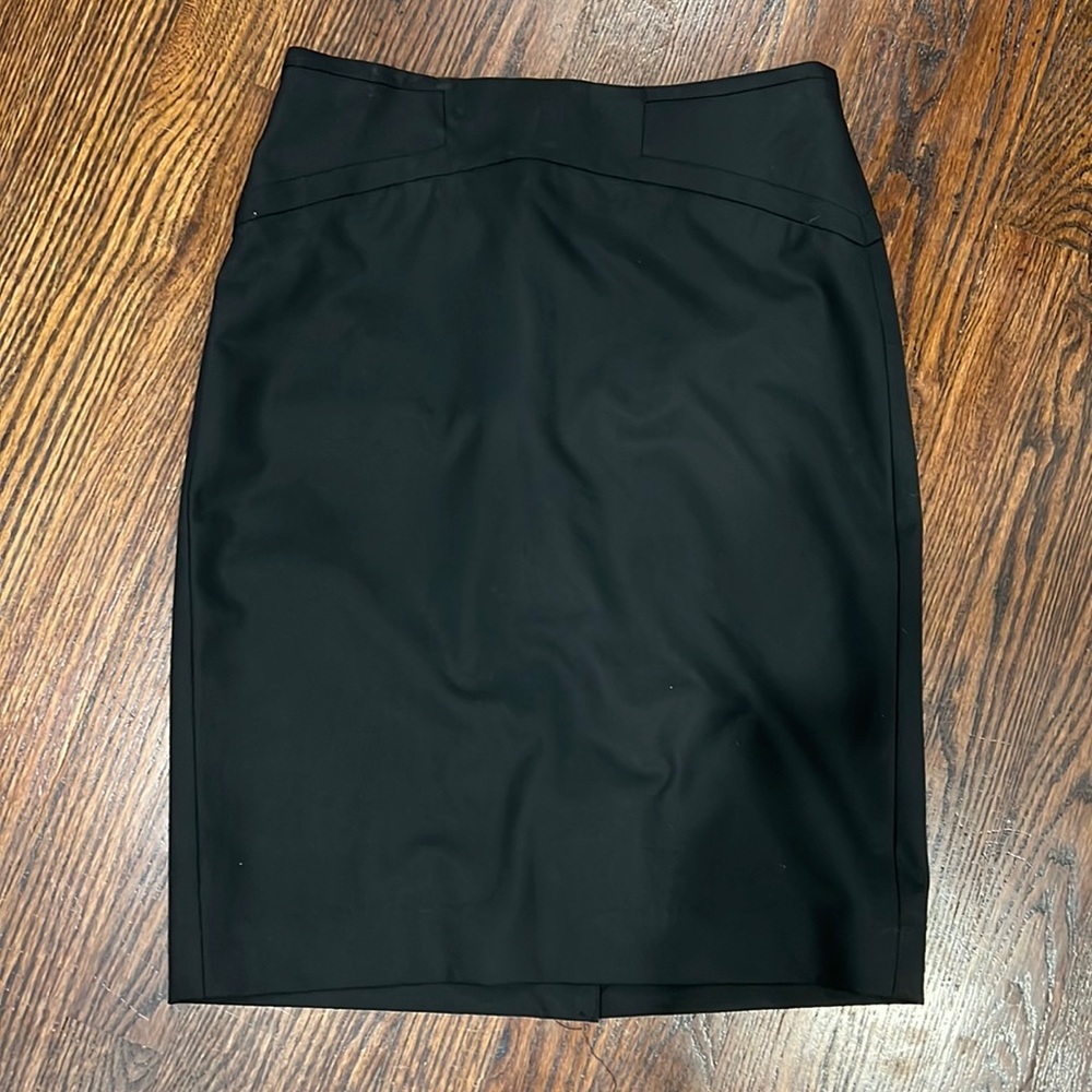 Limited black pencil skirt with small slit in back